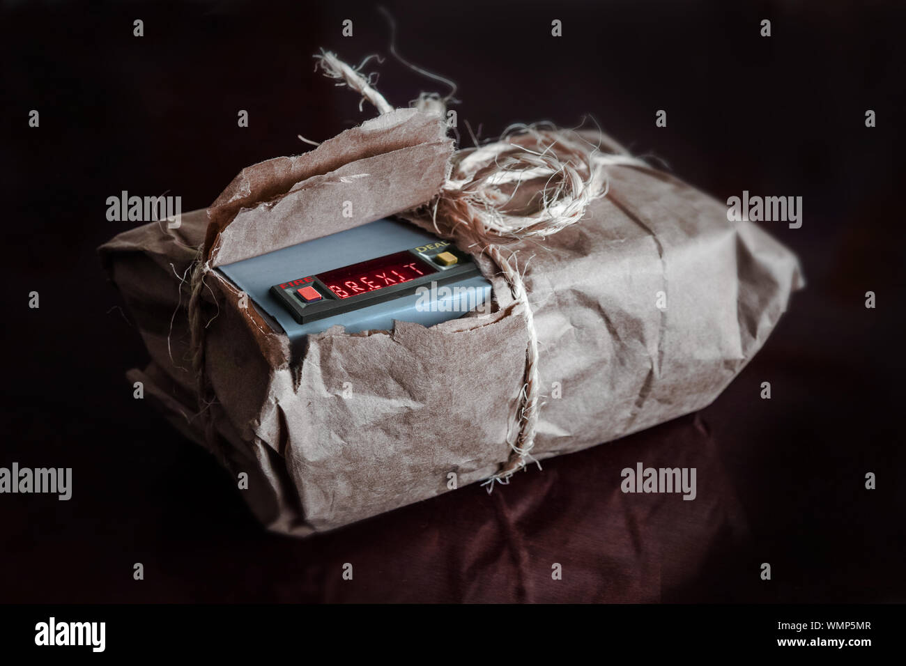 A partially torn package, a BREXIT programmed bomb is revealed. Stock Photo