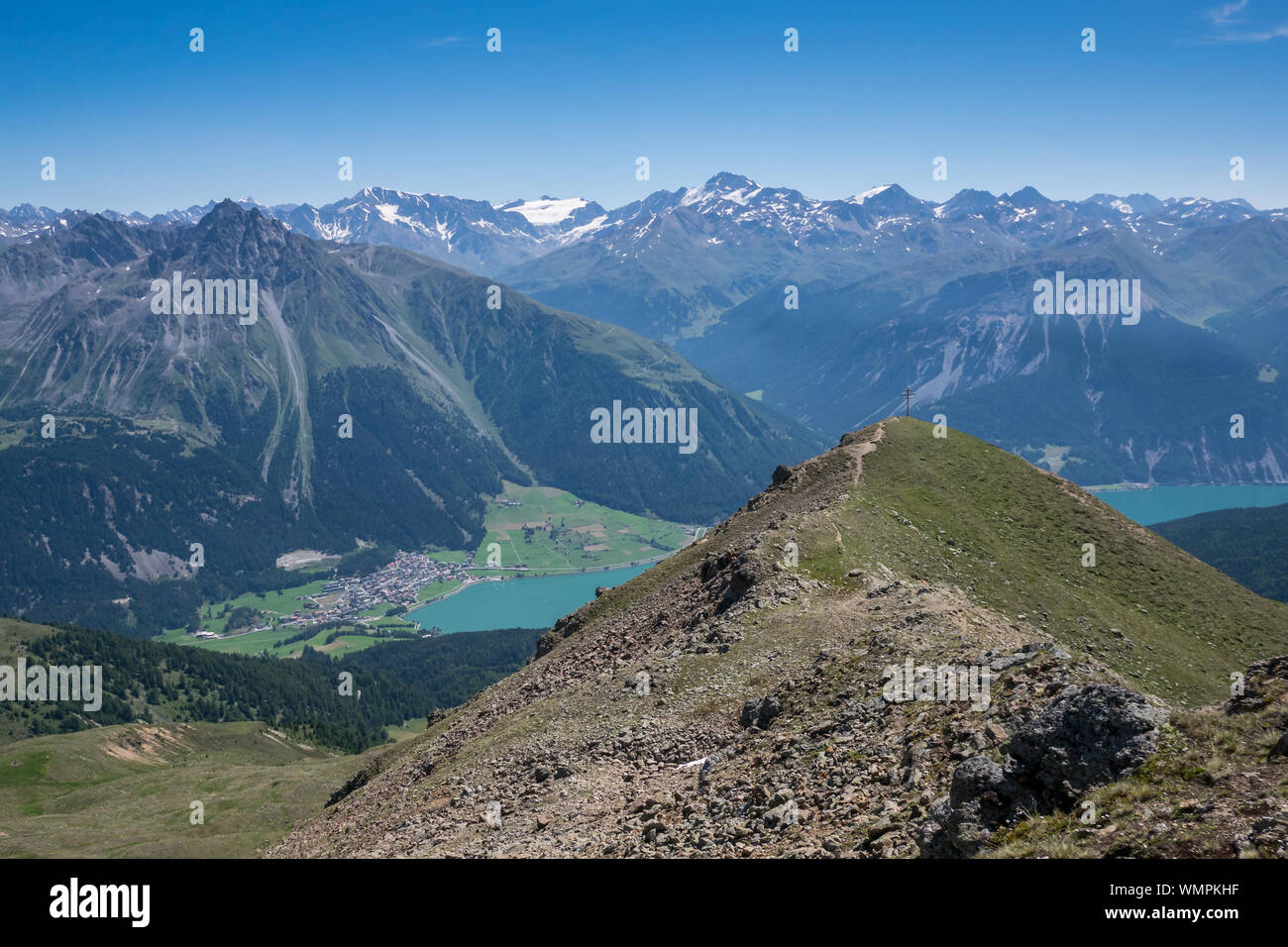 Summit cross of peak Aeusserer Nockenkopf above lake Reschen/Resia, Tyrol, Vinschgau Valley (Venosta Valley), Italy Stock Photo