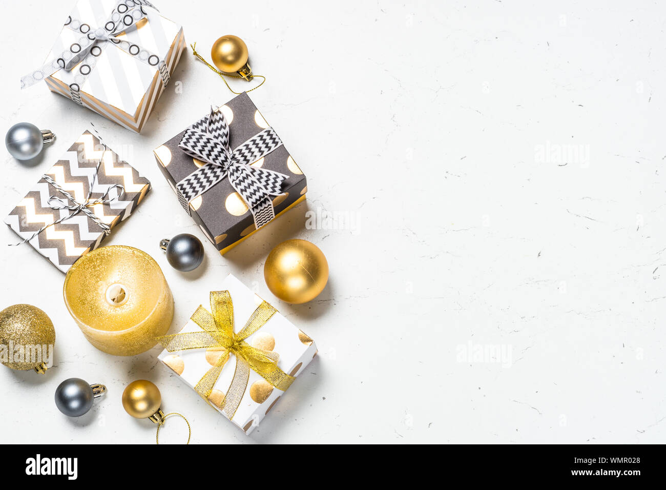 Christmas background with Gold present box and decorations. Stock Photo