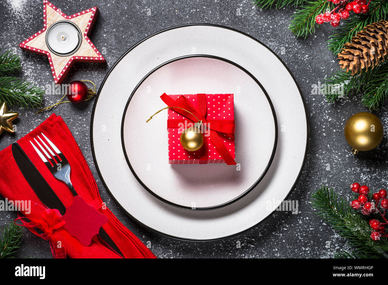 Christmas table setting on black Stock Photo - Alamy