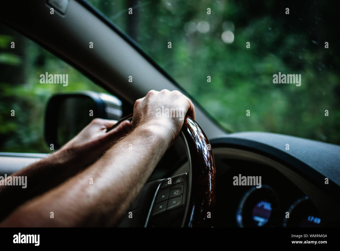 Driving car hands on wheel hires stock photography and images Alamy