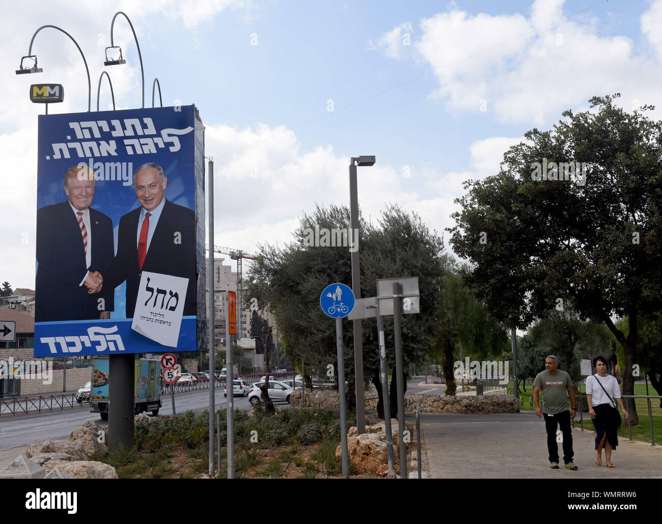 Jerusalem, Israel. 5th Sep 2019. Israelis wak near an election campaign poster with a photo of U.S. President Donald Trump shaking hands with Israeli Prime Minister Benjamin Netanyahu in Jerusalem, Thursday, September 5, 2019. The poster reads in Hebrew 'Netanyahu Is In A League Of His Own.' Israelis return to the polls on September 17, for the second national election in 2019.  Photo by Debbie Hill/UPI Credit: UPI/Alamy Live News Stock Photo