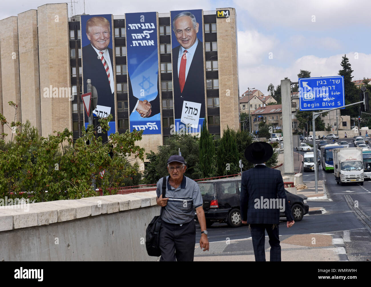 Jerusalem, Israel. 5th Sep 2019. Israelis walk near a large election campaign poster with a photo of U.S. President Donald Trump shaking hands with Israeli Prime Minister Benjamin Netanyahu in Jerusalem, Thursday, September 5, 2019. The poster reads in Hebrew 'Netanyahu Is In A League Of His Own.' Israelis return to the polls on September 17, for the second national election in 2019.  Photo by Debbie Hill/UPI Credit: UPI/Alamy Live News Stock Photo