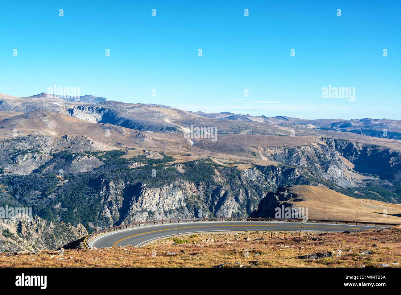 High Angle View Of Highway By Beartooth Mountains Against Sky At Yellowstone National Park Stock Photo