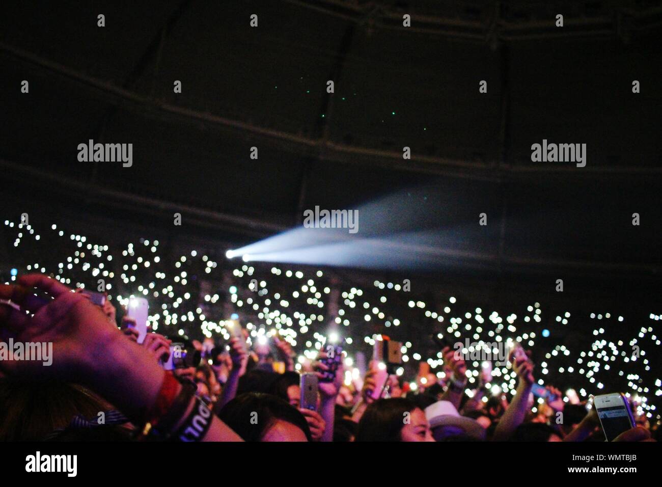 Crowd Holding Up Cell Phones To Record Musical Performance Stock Photo