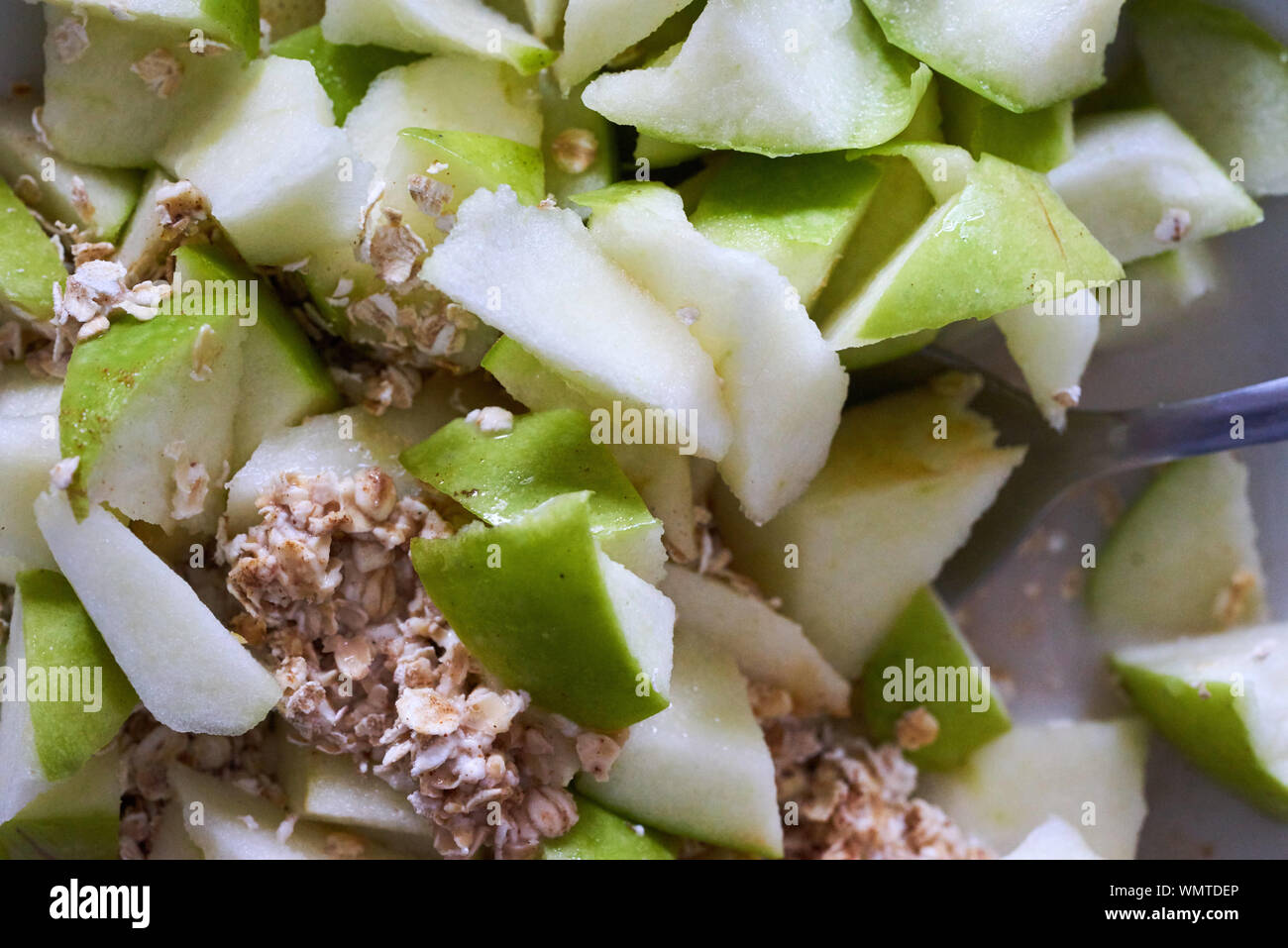 Full Frame Shot Of Breakfast Cereal With Chopped Apples Stock Photo