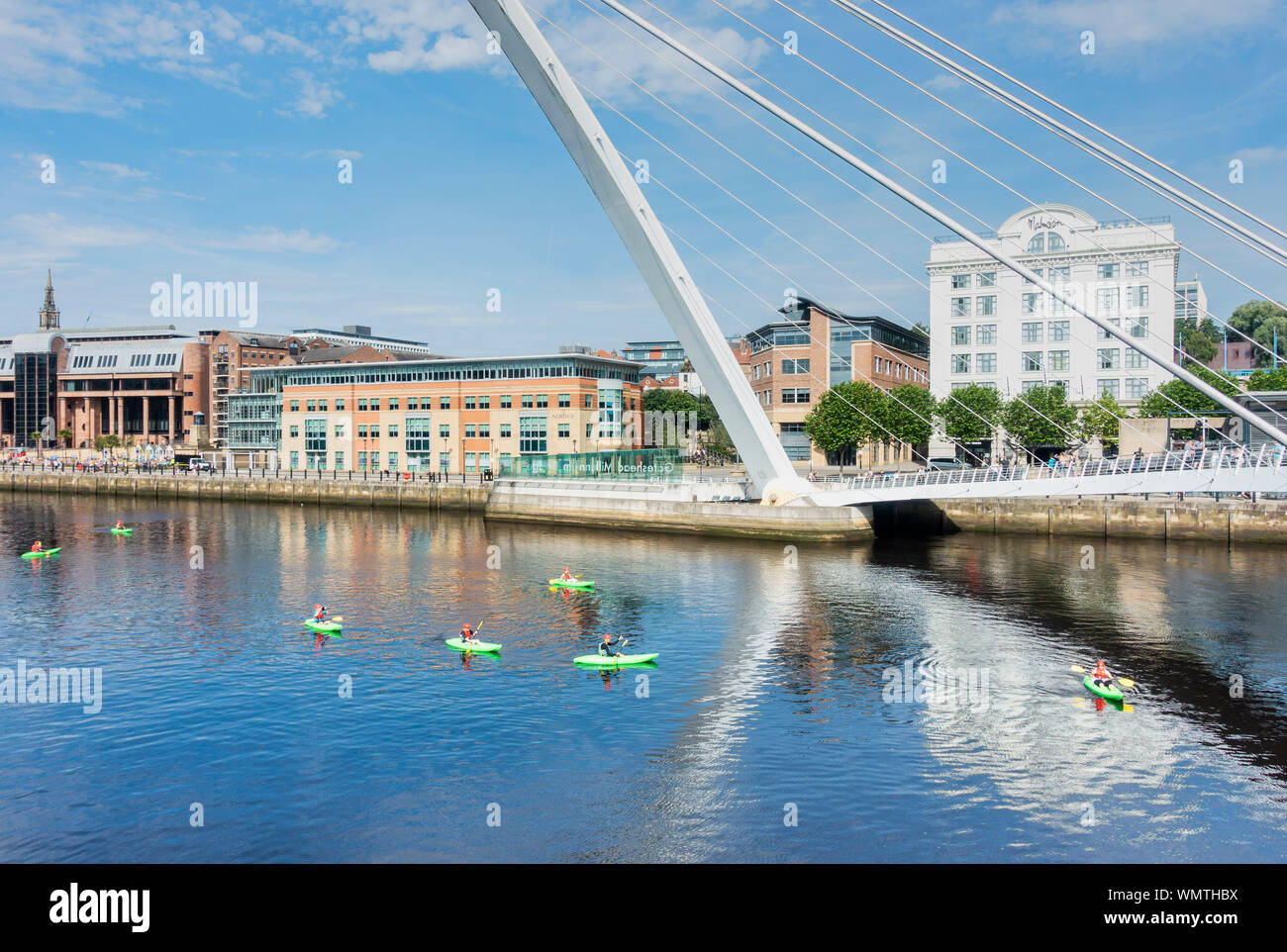 View over river Tyne and Millennium bridge towards Newcastle Quayside from Gateshead Quays. UK. White building is Malmaison hotel. Stock Photo