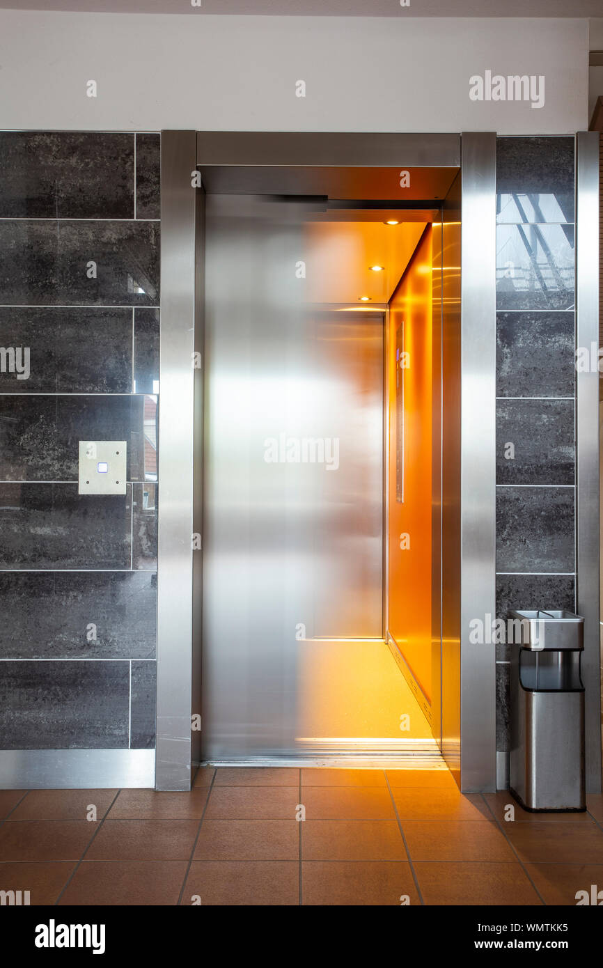 Building Elevator with moving door in apartment complex luxury Stock