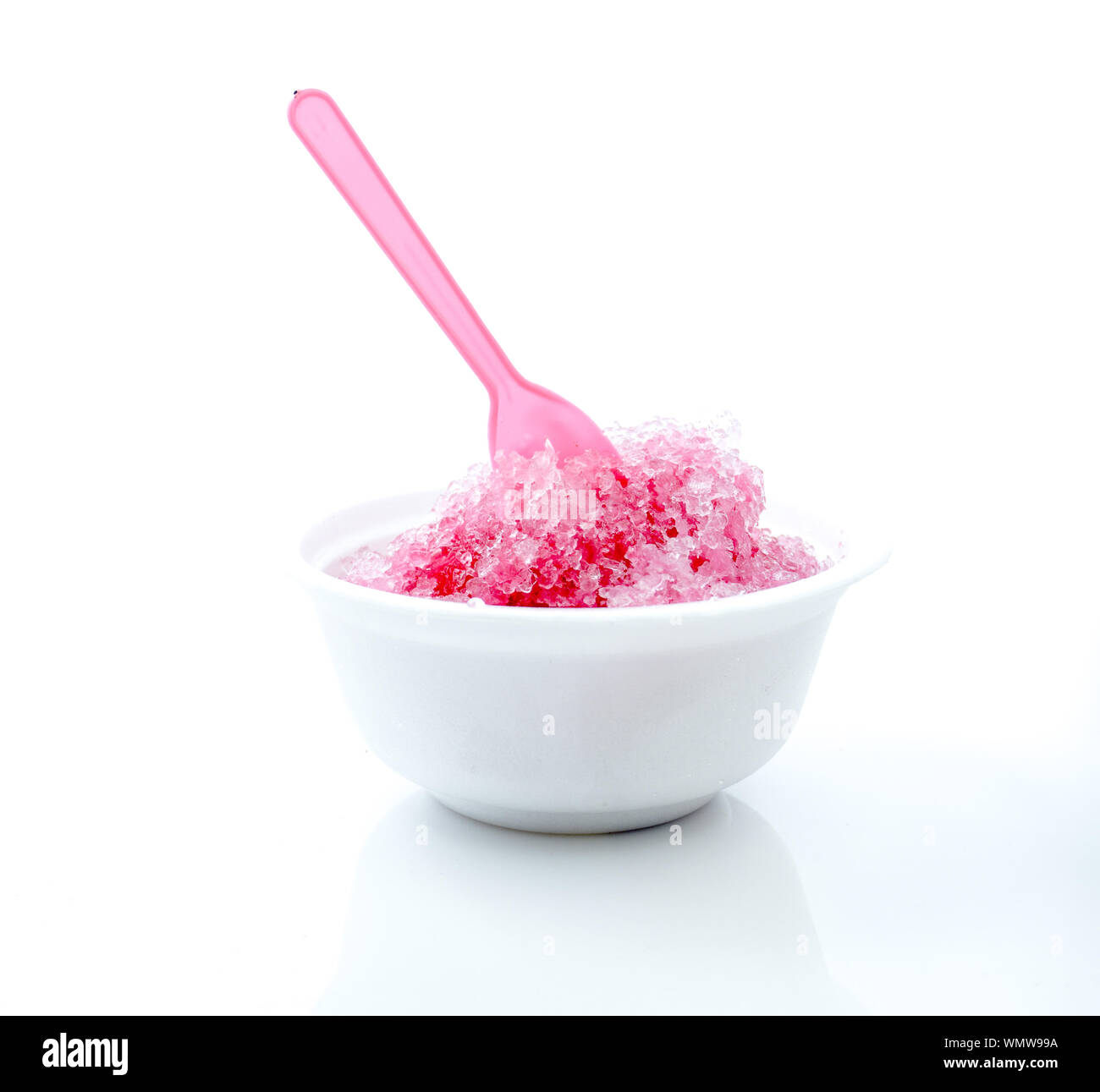 Flavored Ice In Bowl Against White Background Stock Photo