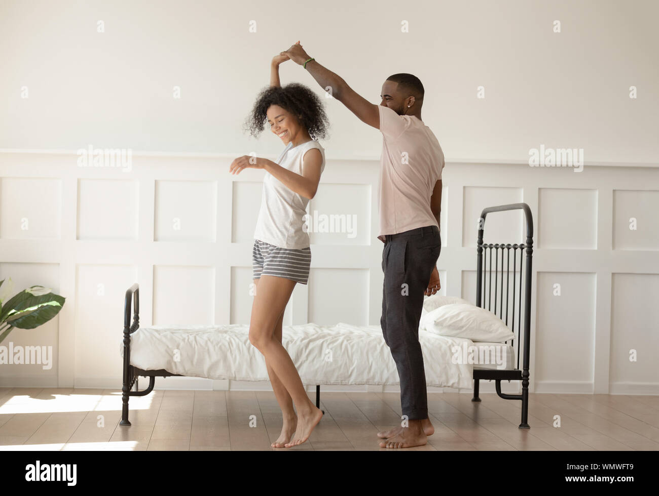 Happy barefoot young woman dancing hi-res stock photography and images ...