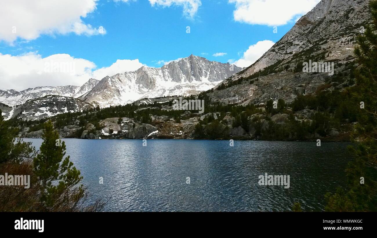 Scenic View Of River With Mountains Against Sky At High Sierra Stock Photo