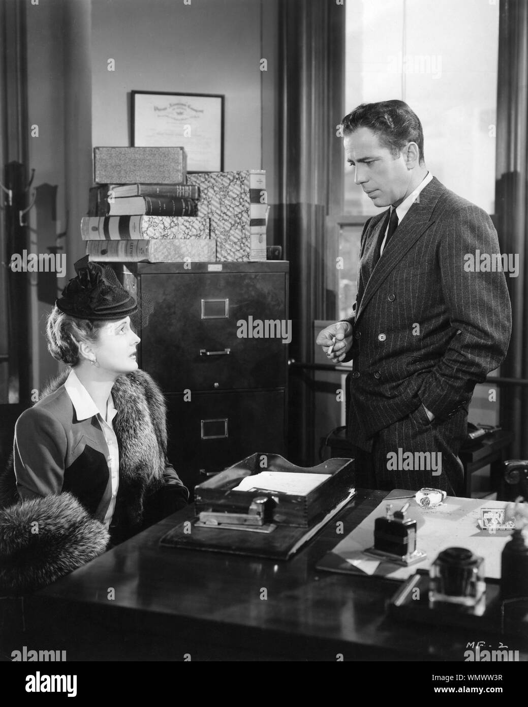 MARY ASTOR as Brigid O'Shaughnessy and HUMPHREY BOGART as Samuel Spade