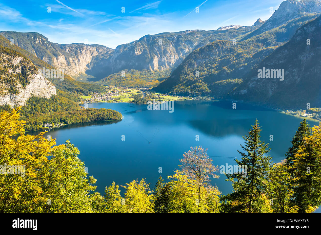 Hallstatt, Austria. Panoramic aerial view of the lake Hallstatter See surrounded by steep slopes of Dachstein massif with trees in Austrian Alps mount Stock Photo