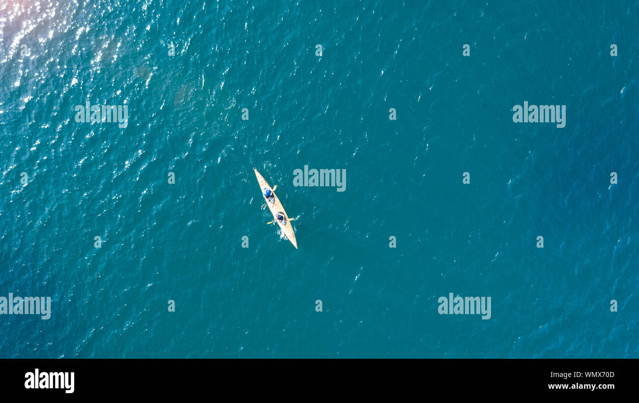 aerial drone view from the top to the blue lagoon with azure sea water with a boat with copy space, vacation travel concept Stock Photo