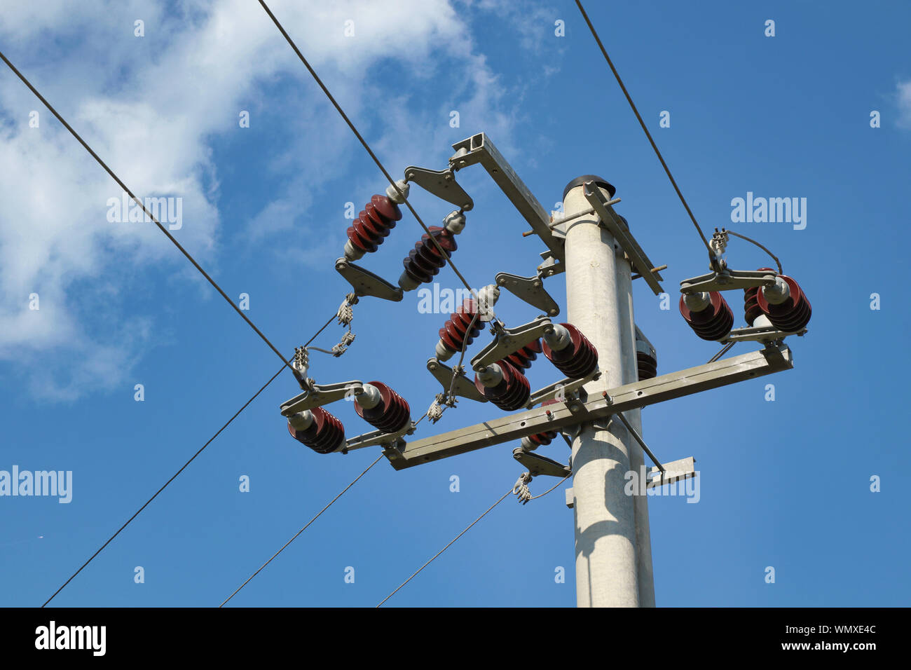 Concrete pole with high voltage three phase power line Stock Photo