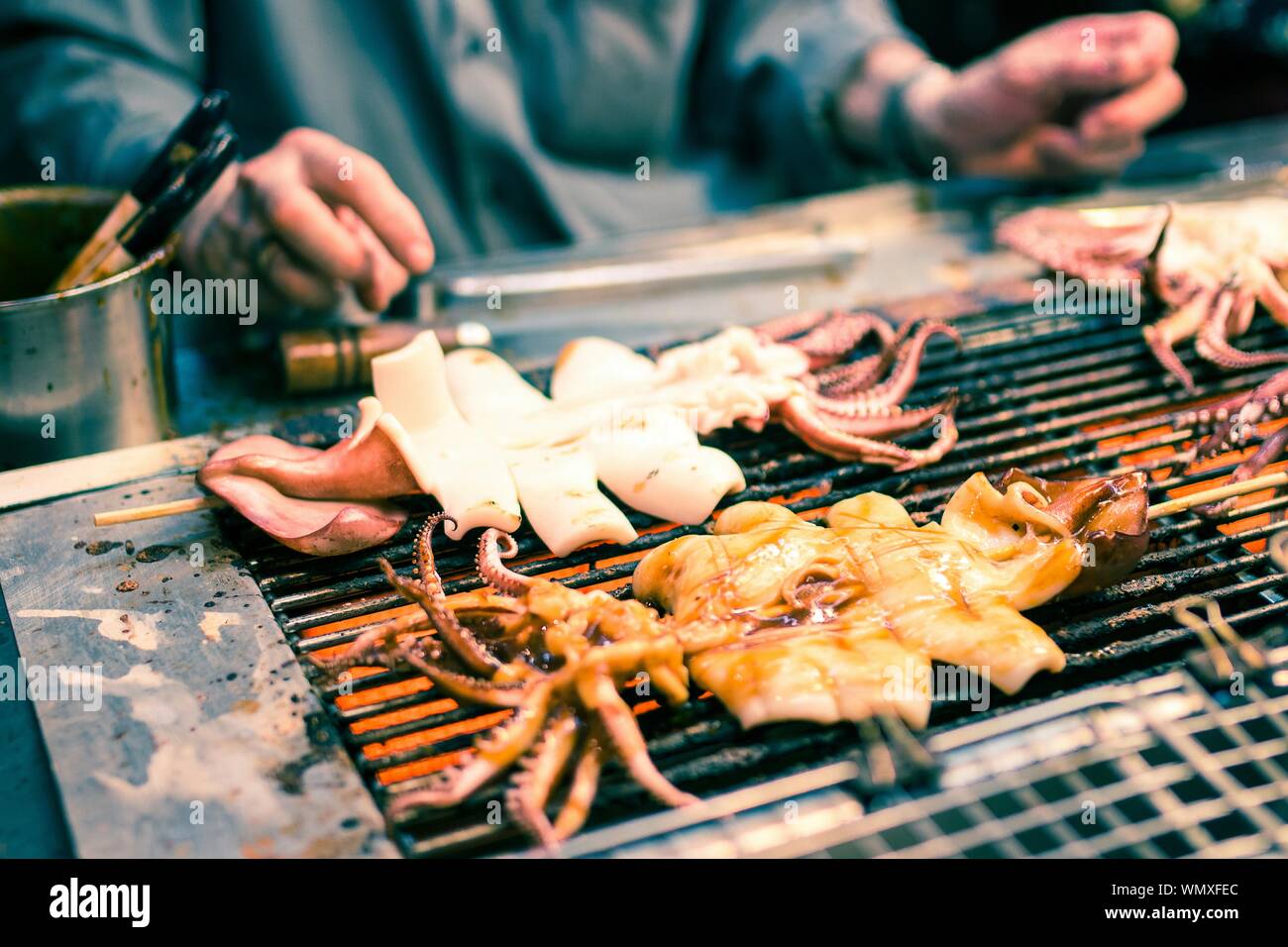 High Angle View Of Squids Being Gilled On Barbeque Stock Photo