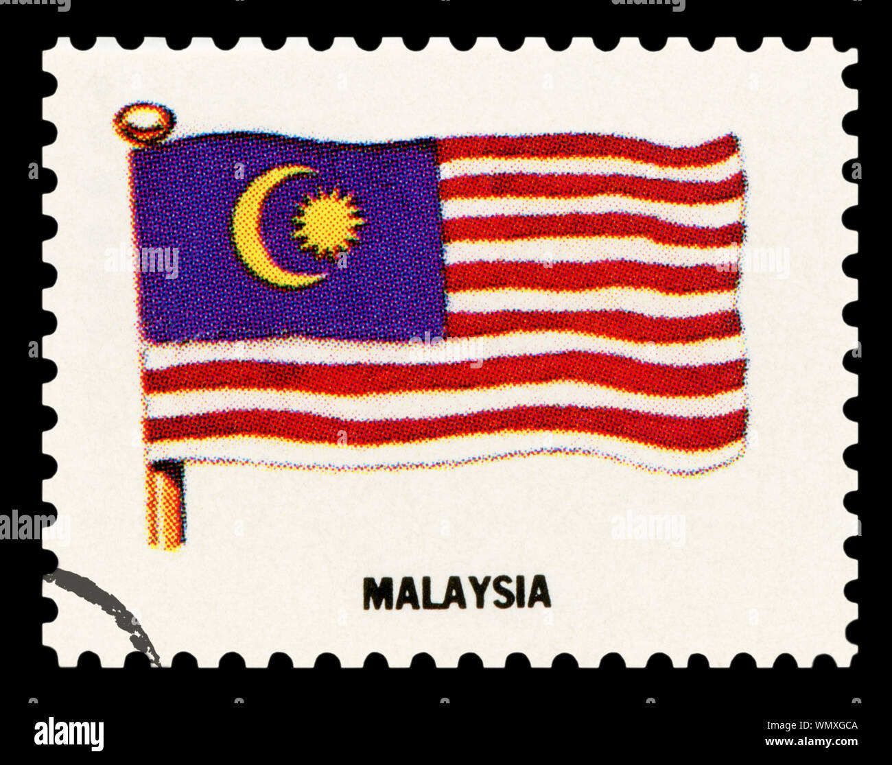 MALAYSIA FLAG - Postage Stamp isolated on black background. Stock Photo