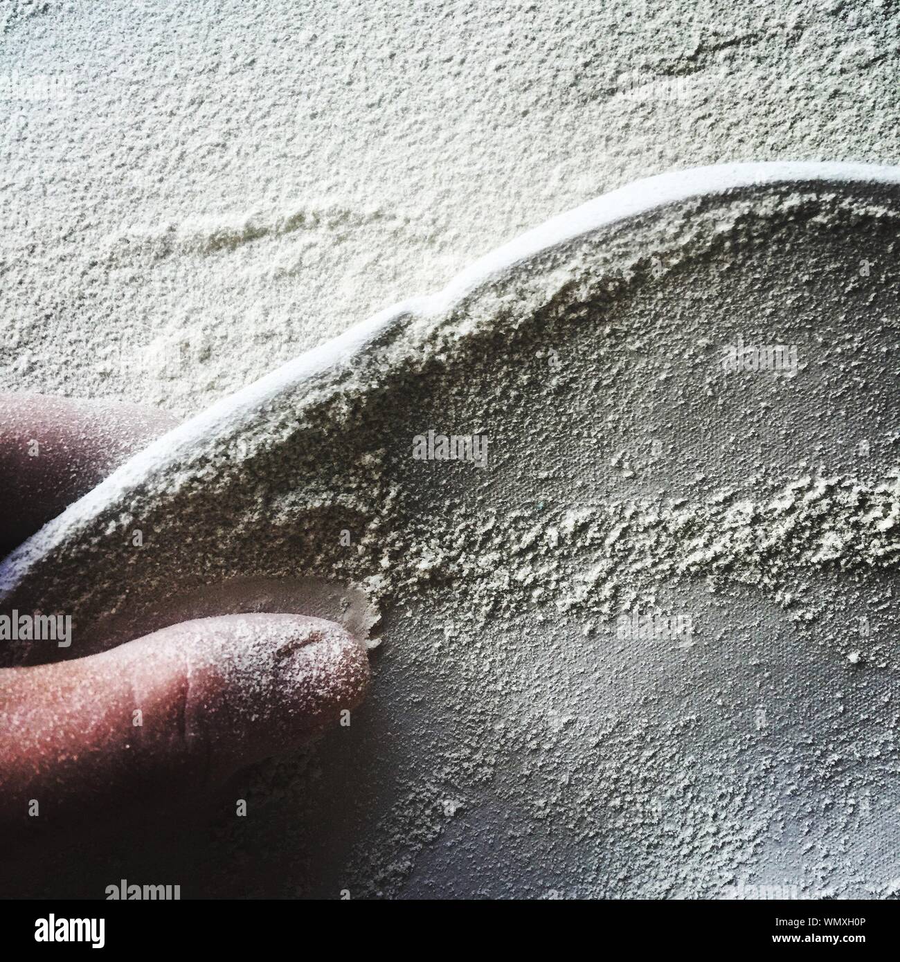 Cropped Image Of Craftsperson With Sand At Workshop Stock Photo