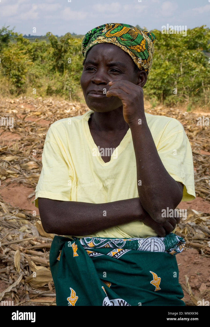 Close up of female farmer, standing in a field in Malawi Stock Photo