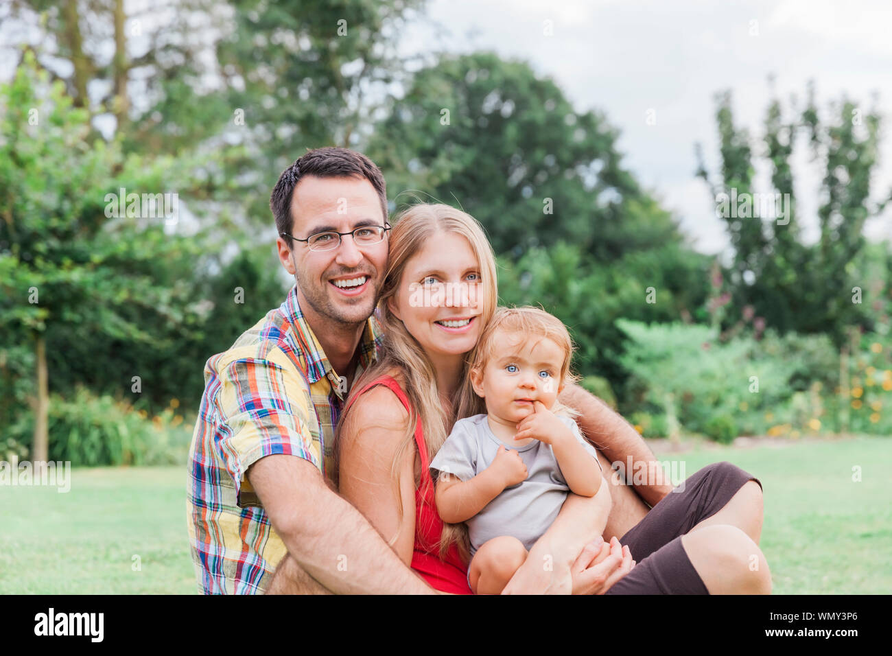 Family portrait at the park hi-res stock photography and images - Alamy