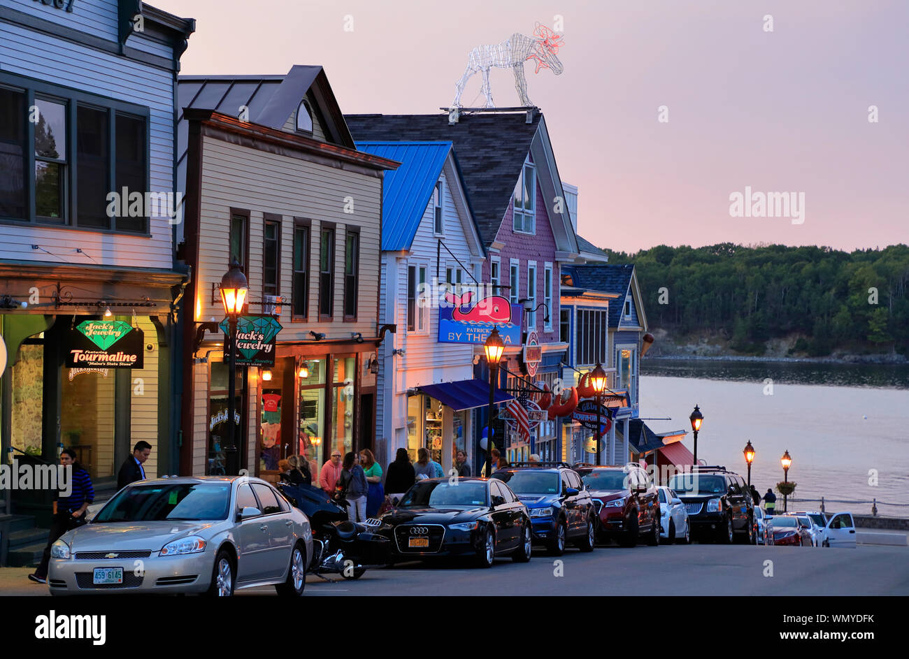 The main street of Bar Harbor towards harbor and waterfront during twilight hour.Bar Harbor.Mount Desert Island.Maine.USA Stock Photo