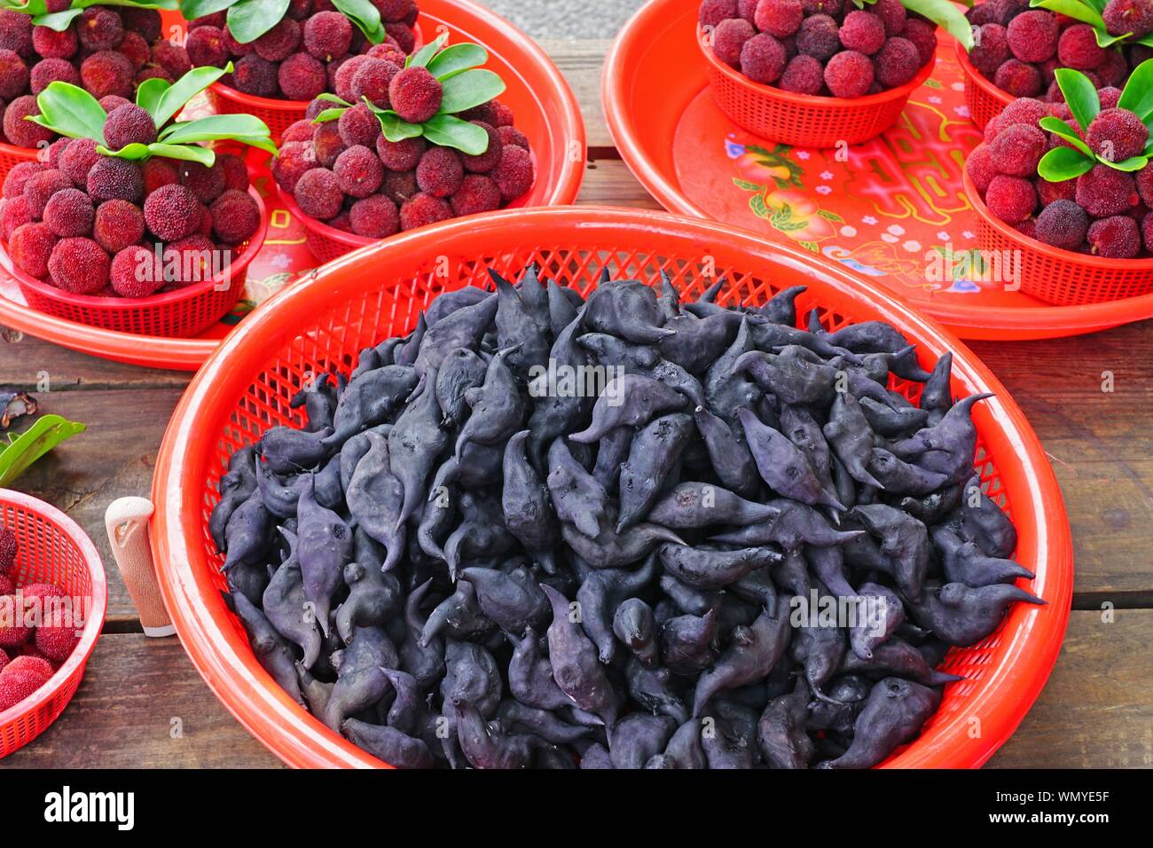 View of black water caltrop water chestnuts shaped like bats (buffalo nut, bat nut, devil pod, ling nut, lin kok, ling kio nut, mustache nut) Stock Photo