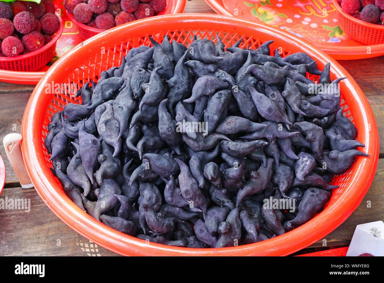 View of black water caltrop water chestnuts shaped like bats (buffalo nut, bat nut, devil pod, ling nut, lin kok, ling kio nut, mustache nut) Stock Photo
