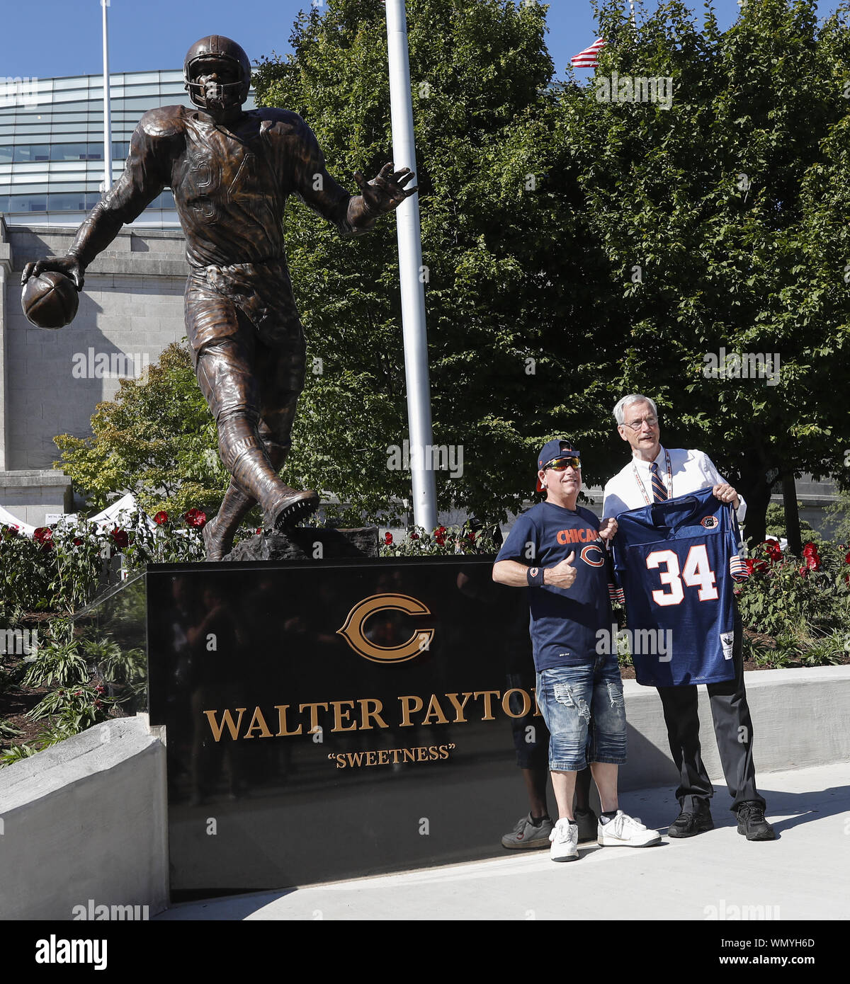 Chicago, United States. 05th Sep, 2019. Chicago Bears chairman George McCaskey poses for a picture with a fan next to newly dedicated statue of Chicago Bears and Pro Football Hall of Fame running back Walter Payton outside Soldier Field before the Chicago Bears and Green Bay Packers NFL game in Chicago on Thursday, September 5, 2019. Photo by Kamil Krzaczynski/UPI Credit: UPI/Alamy Live News Stock Photo