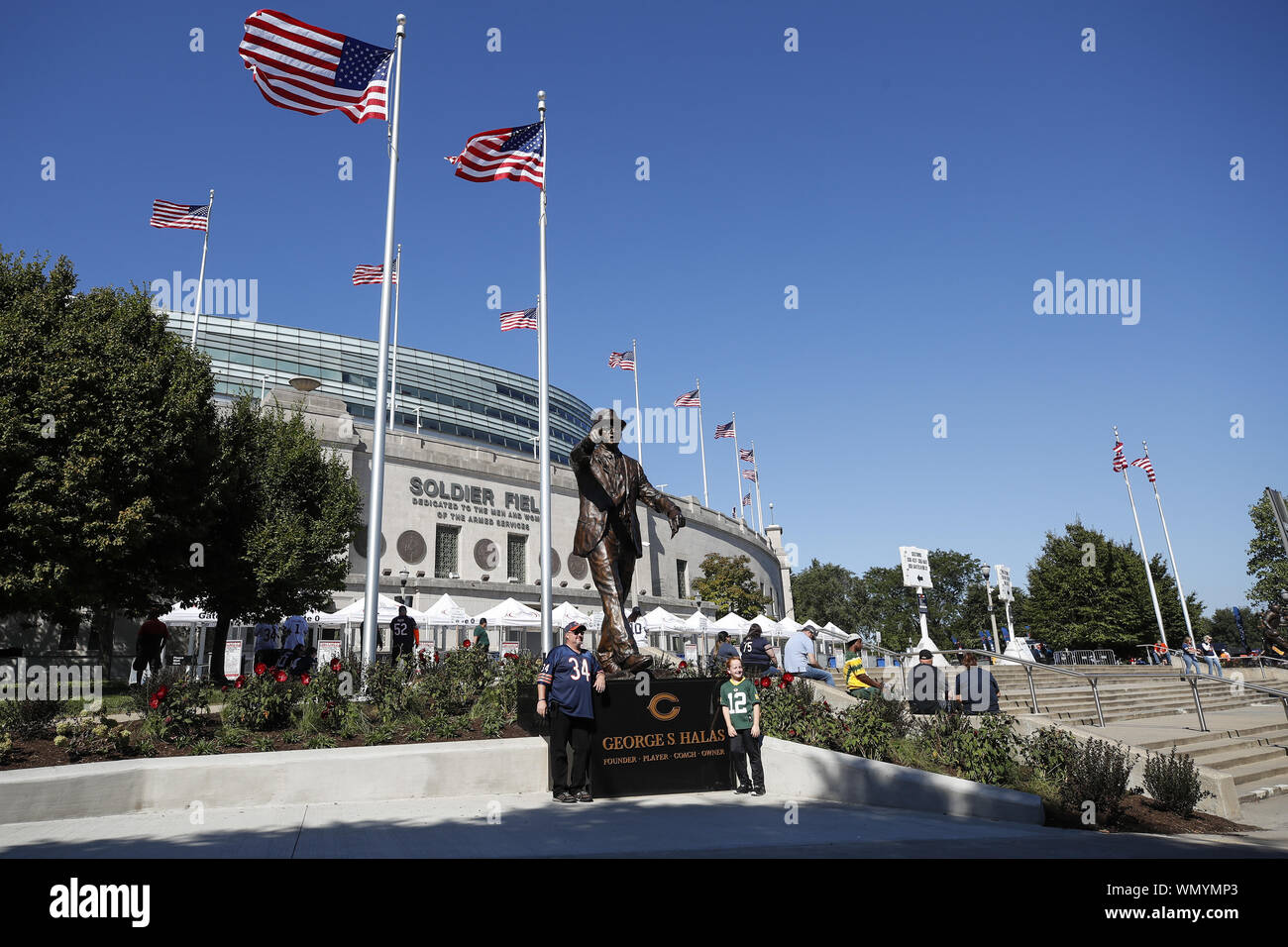 Chicago, United States. 05th Sep, 2019. Fans pose for a picture next to newly dedicated statue of Chicago Bears founder George S. Halas outside Soldier Field before the Chicago Bears and Green Bay Packers NFL game in Chicago on Thursday, September 5, 2019. Photo by Kamil Krzaczynski/UPI Credit: UPI/Alamy Live News Stock Photo