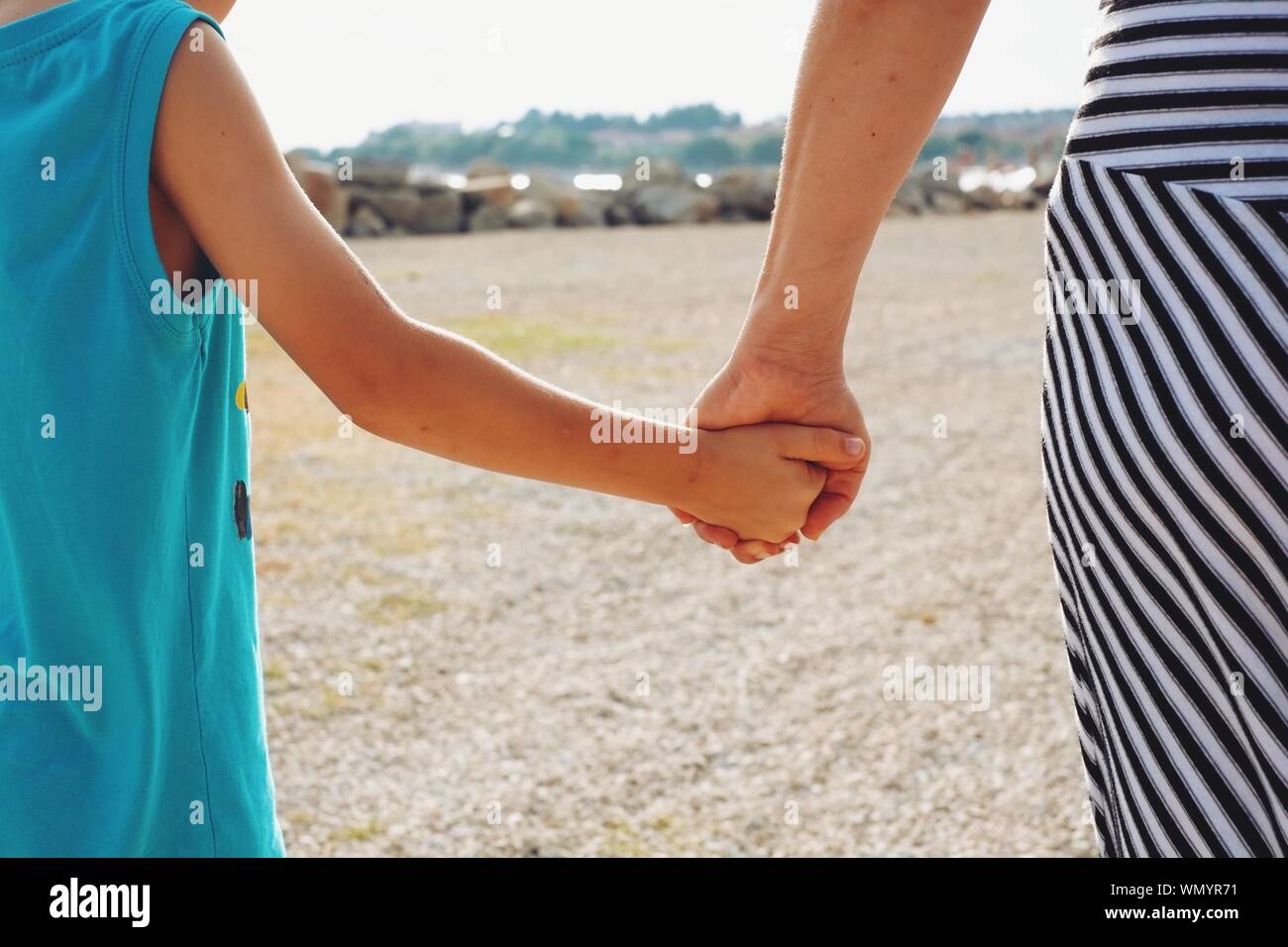 Mother holding son hands hi-res stock photography and images - Alamy
