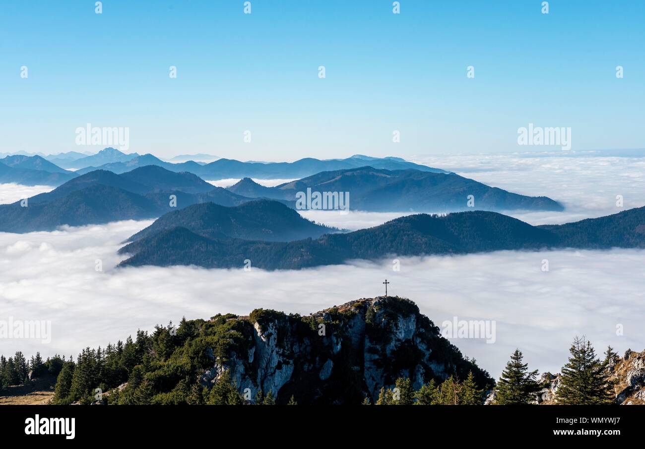 View from the summit of Breitenstein to the summit of Bockstein, high fog above the valley, Fischbachau, Bavaria, Germany Stock Photo