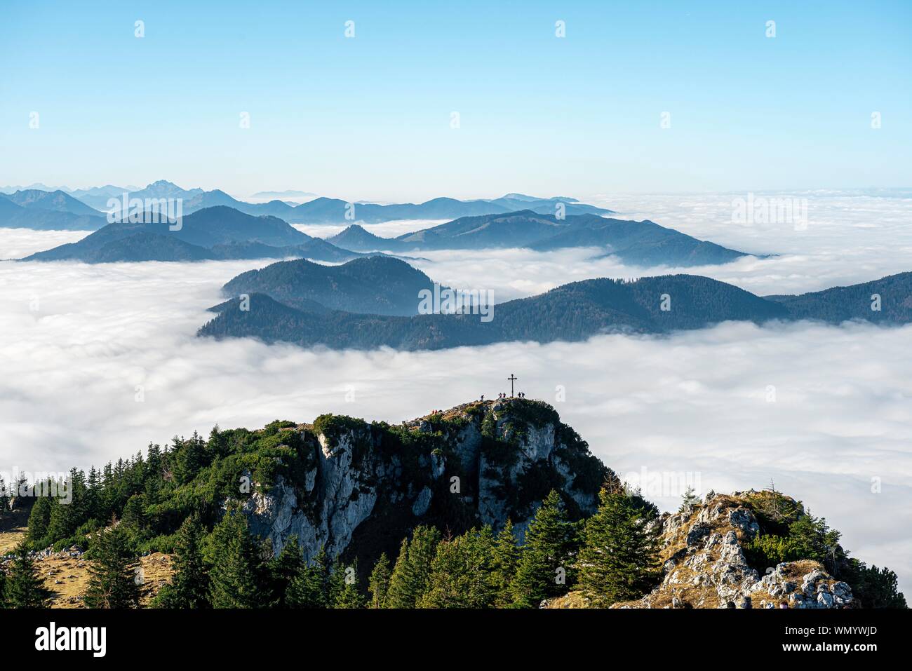 View from the summit of Breitenstein to the summit of Bockstein, high fog above the valley, Fischbachau, Bavaria, Germany Stock Photo