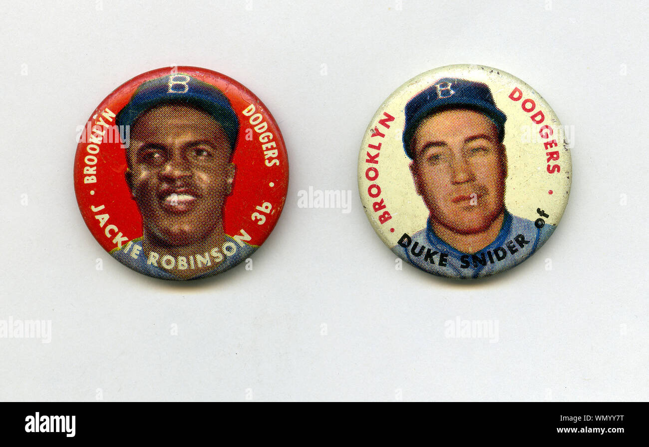 1950s era souvenir pins of  teammates Duke Snider and  Jackie Robinson, the legendary Hall of fame baseball player who broke the Major League Baseball color line with the Brooklyn Dodgers. Stock Photo