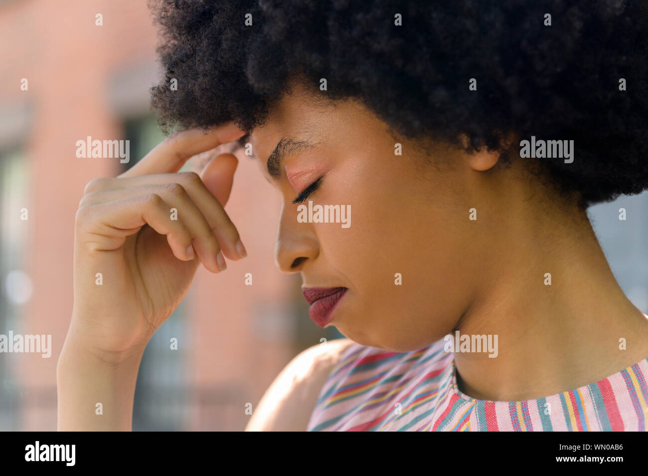 Young woman with headache Stock Photo