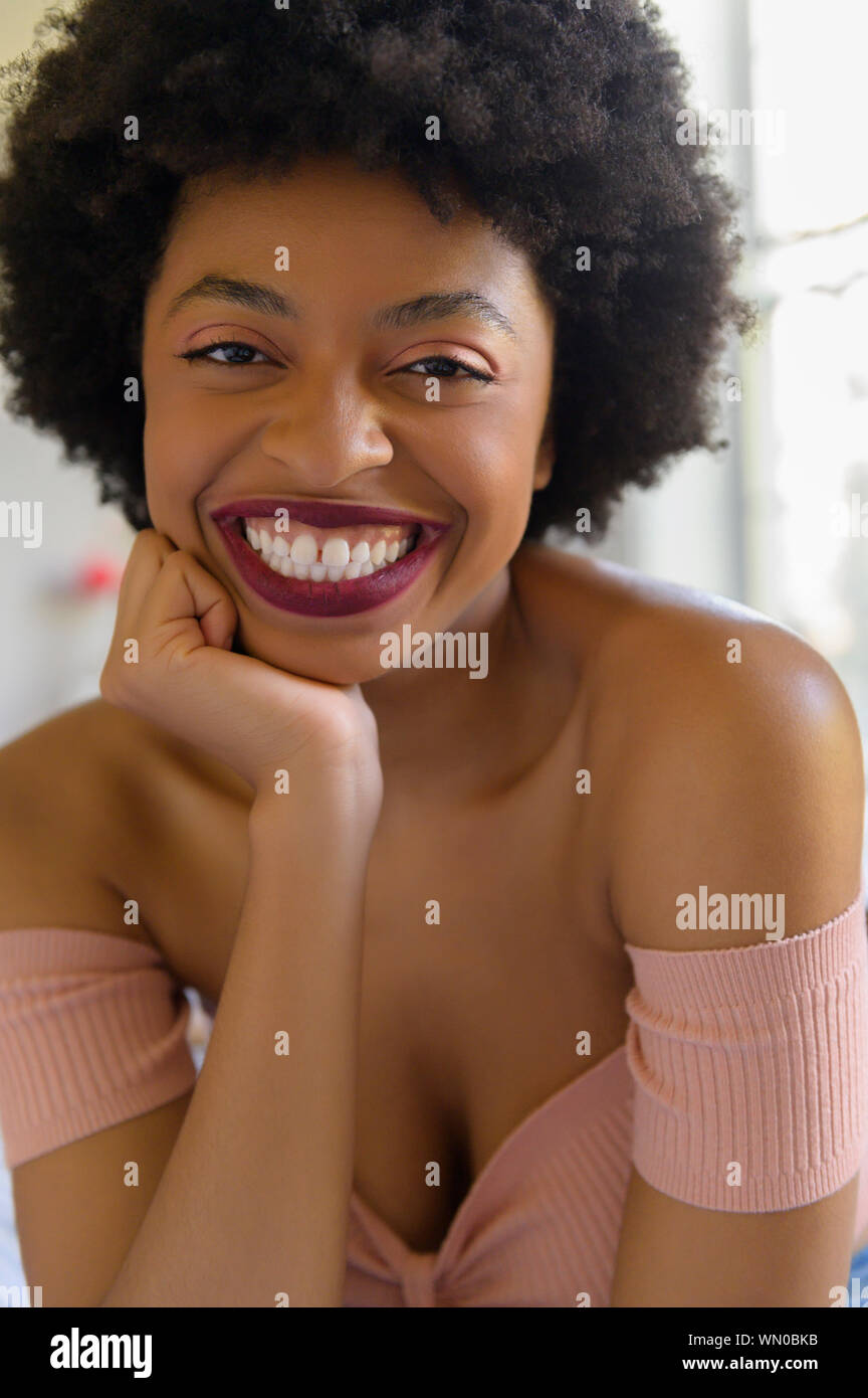 Portrait of smiling young woman wearing lipstick Stock Photo