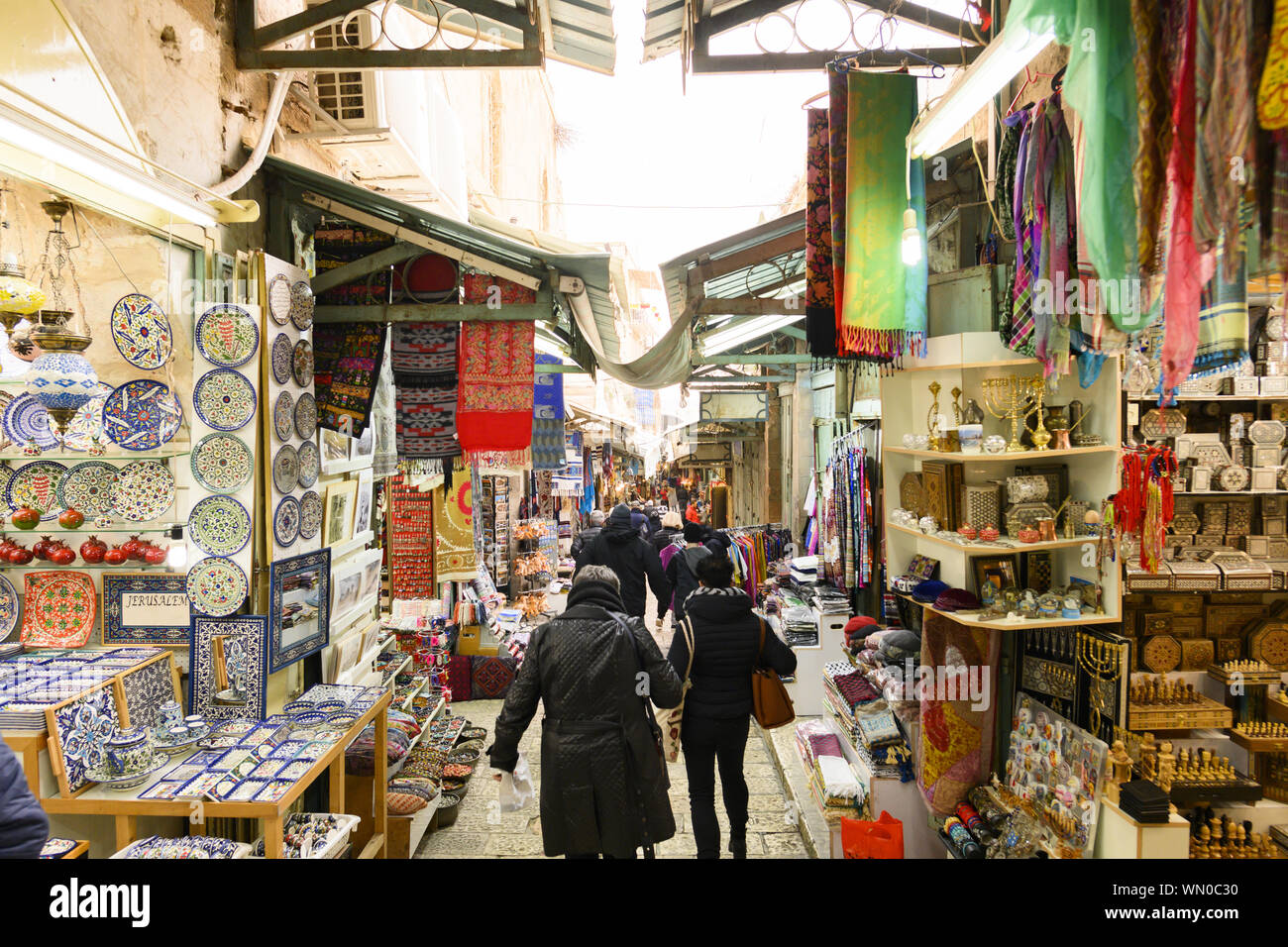 Locals and tourists at the Mahane Yehuda Market on a busy Friday. Mahane Yehuda Market often referred to as "The Shuk is a marketplace in Jerusalem. Stock Photo