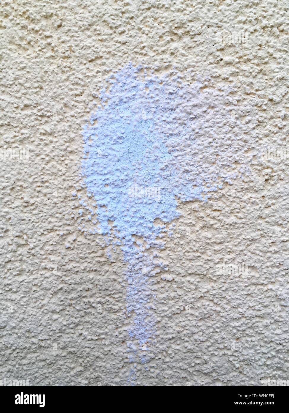 Full Frame Shot Of White Wall With Blue Stain Stock Photo
