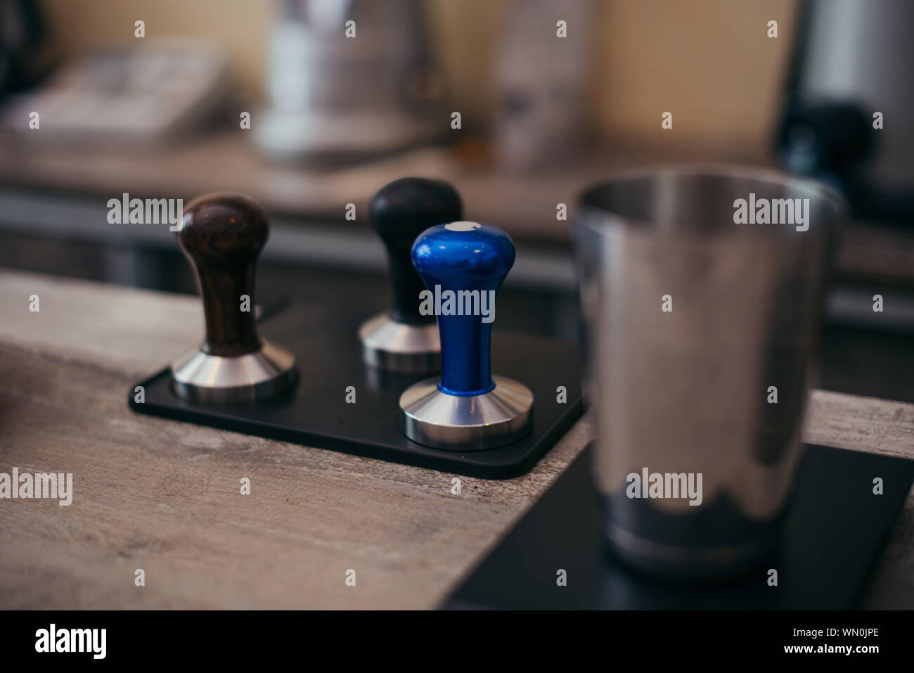Equipment for coffee machine on wooden table in coffee shop Stock Photo