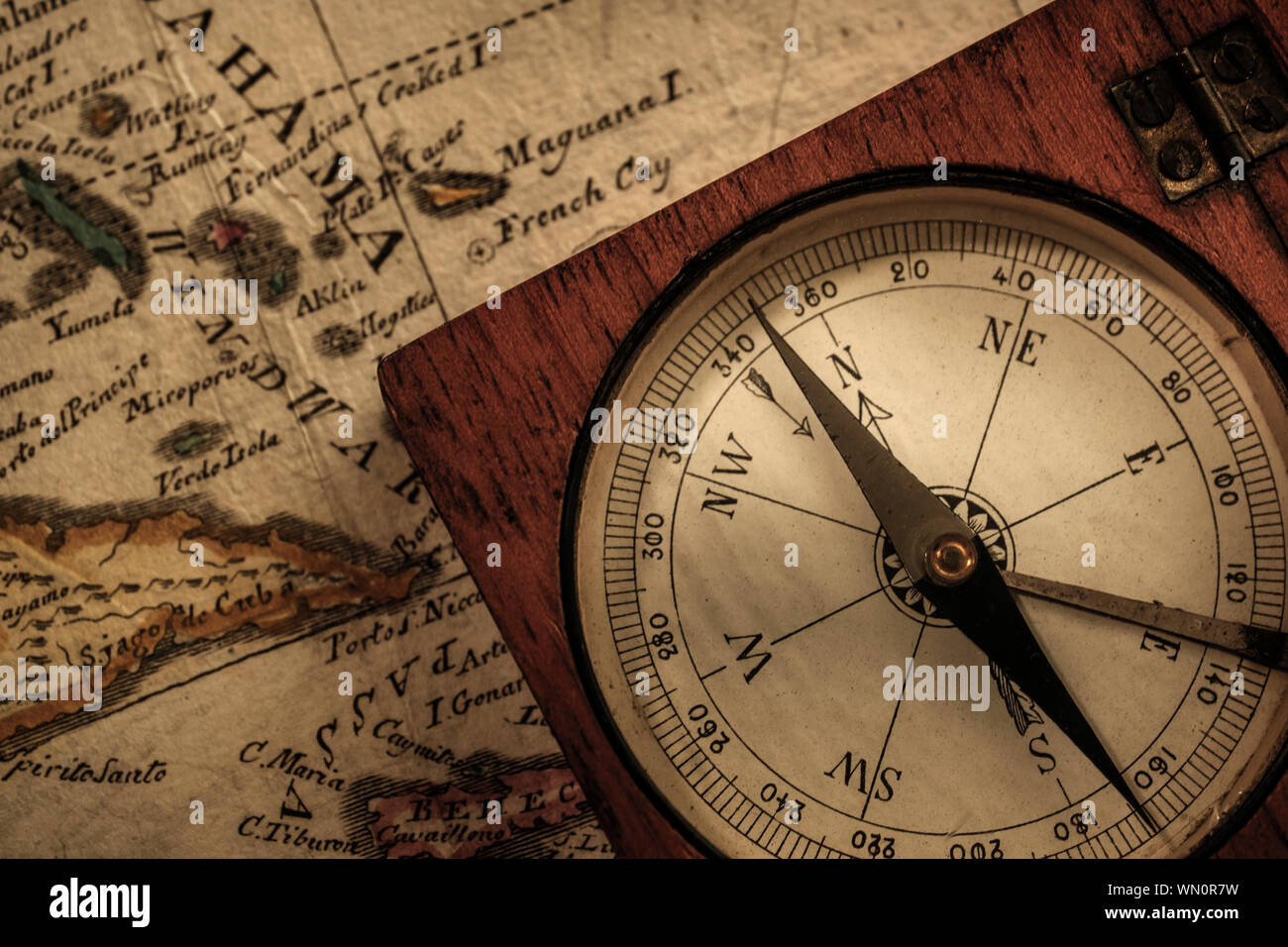 Antique compass on map Stock Photo