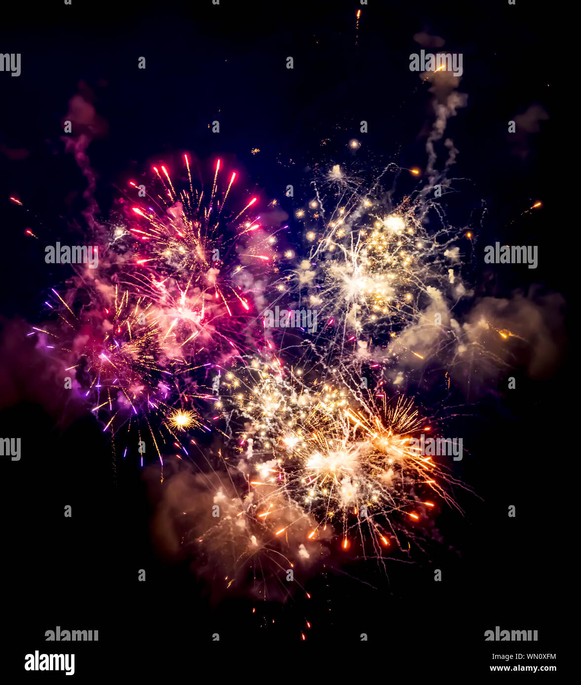 Low Angle View Of Colorful Fireworks Display Against Sky At Night Stock Photo