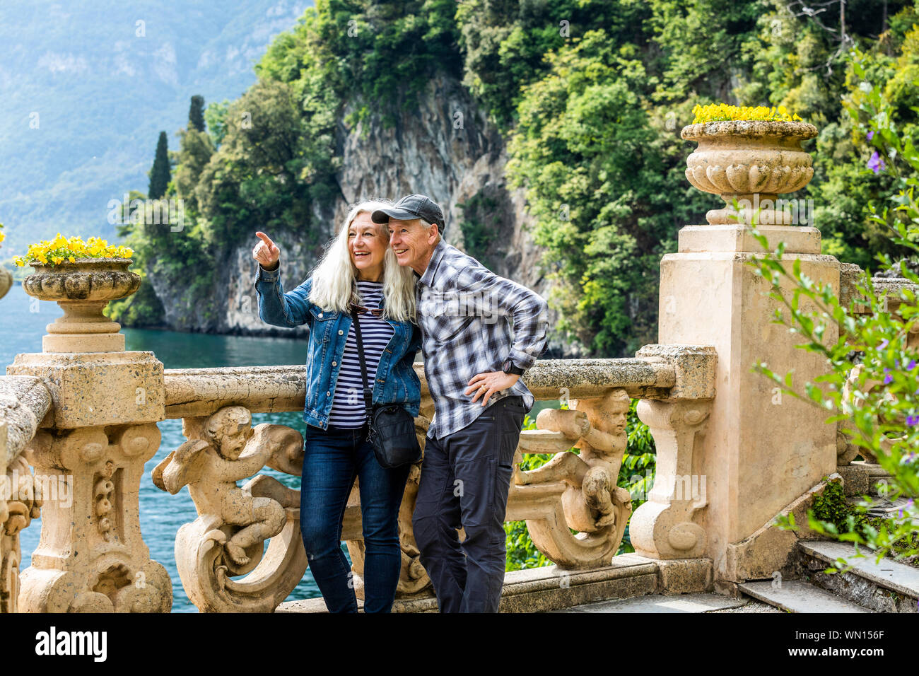 Smiling couple at Villa del Balbianello by Lake Como, Italy Stock Photo