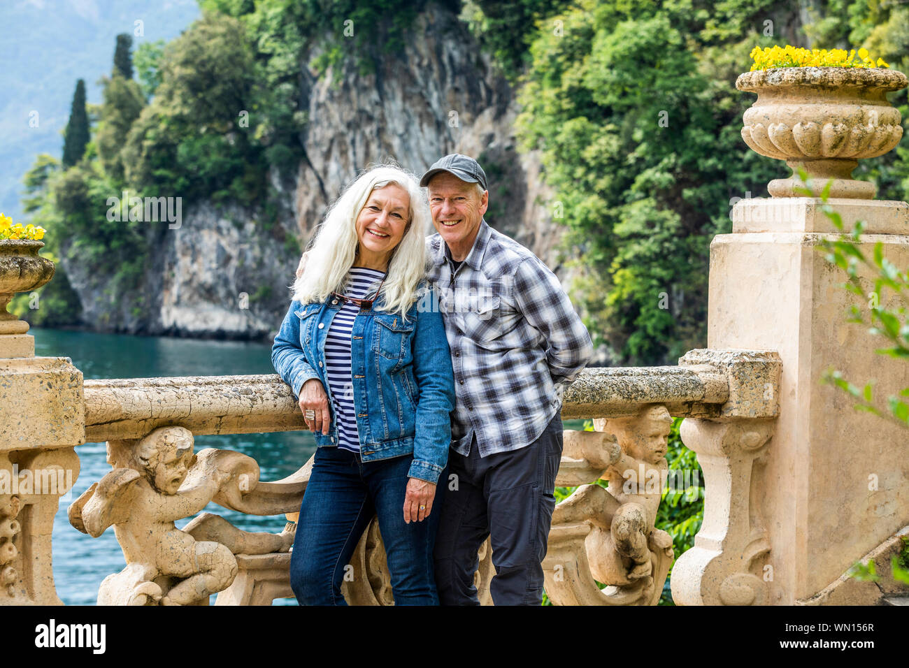 Smiling couple at Villa del Balbianello by Lake Como, Italy Stock Photo