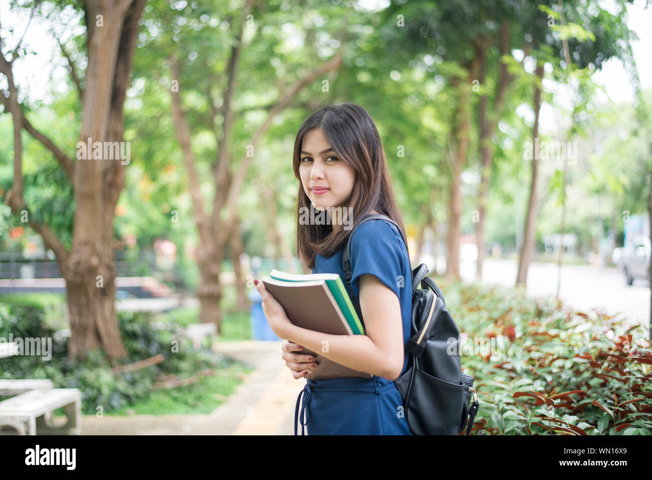 Portrait Of Smiling University Student In Campus Stock Photo