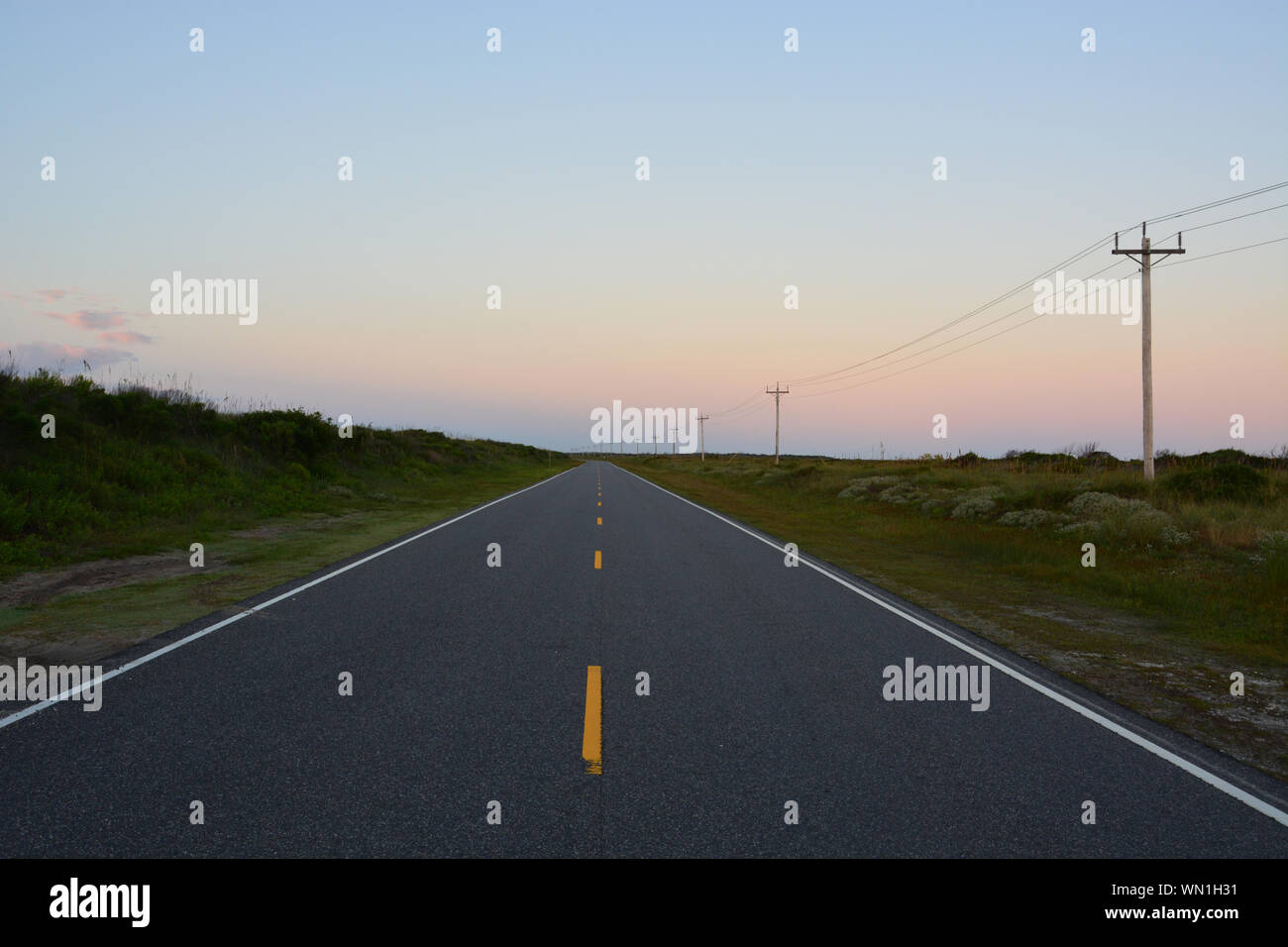 Sunrise on NC12 in Ocracoke. NC12 runs the length of the Outer Banks