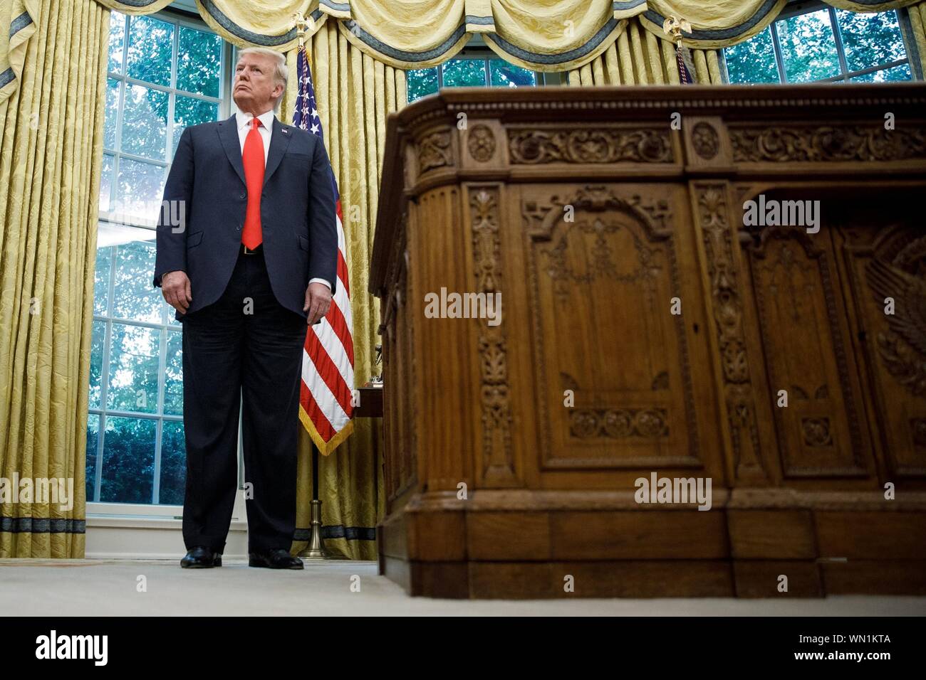 United States President Donald J. Trump during a Presentation of the Medal of Freedom to NBA Hall of Fame member Jerry West at a ceremony inside of the Oval Office on September 5, 2019, at the White House in Washington. West, 81, graduated from West Virginia University and played fourteen seasons with the Los Angeles Lakers. Credit: Tom Brenner/Pool via CNP /MediaPunch Stock Photo