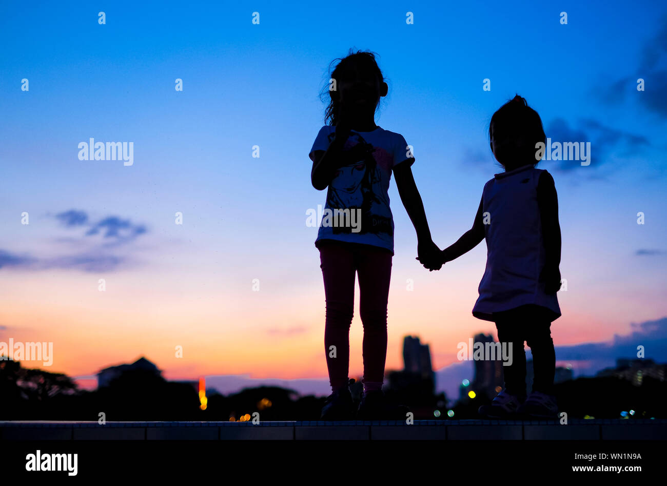 Page 2 Silhouette Two Girls Holding Hands High Resolution Stock Photography And Images Alamy