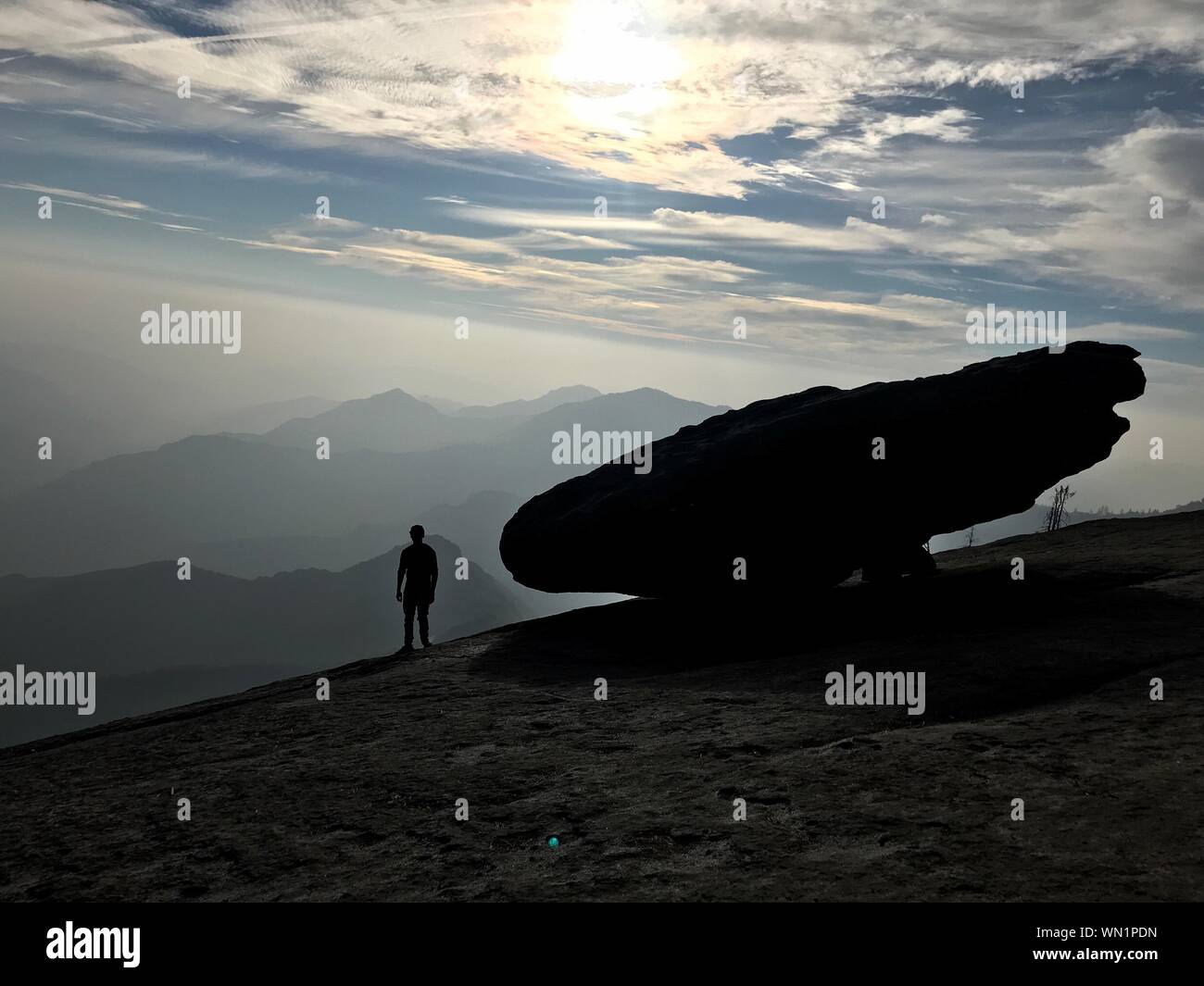 Silhouette man mountain peak sunset hi-res stock photography and images ...