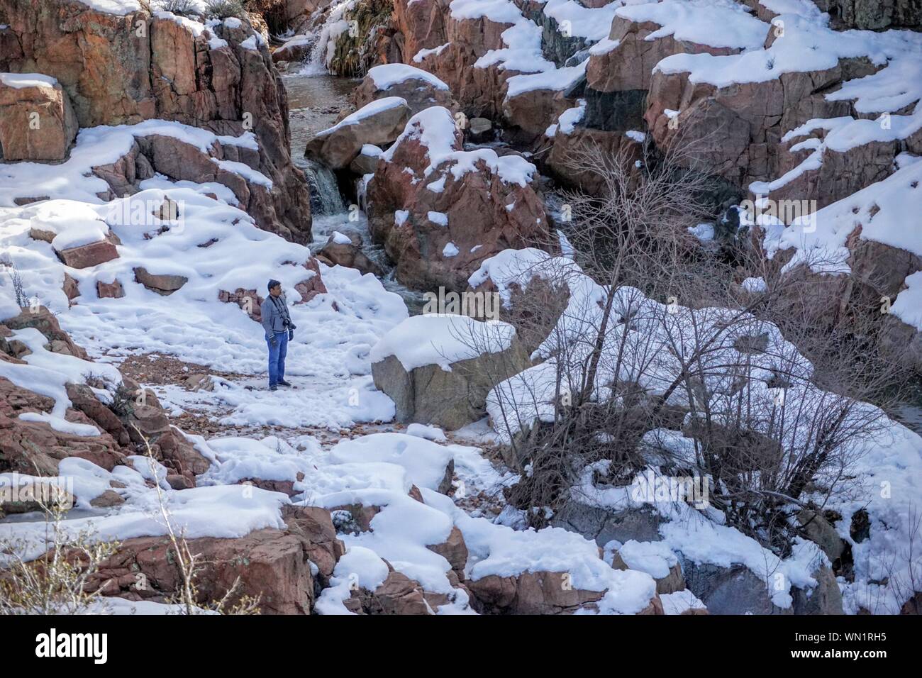 Man Standing On Snowy Rock Stock Photo Alamy Man Standing On Snowy Rock Stock Photo Alamy