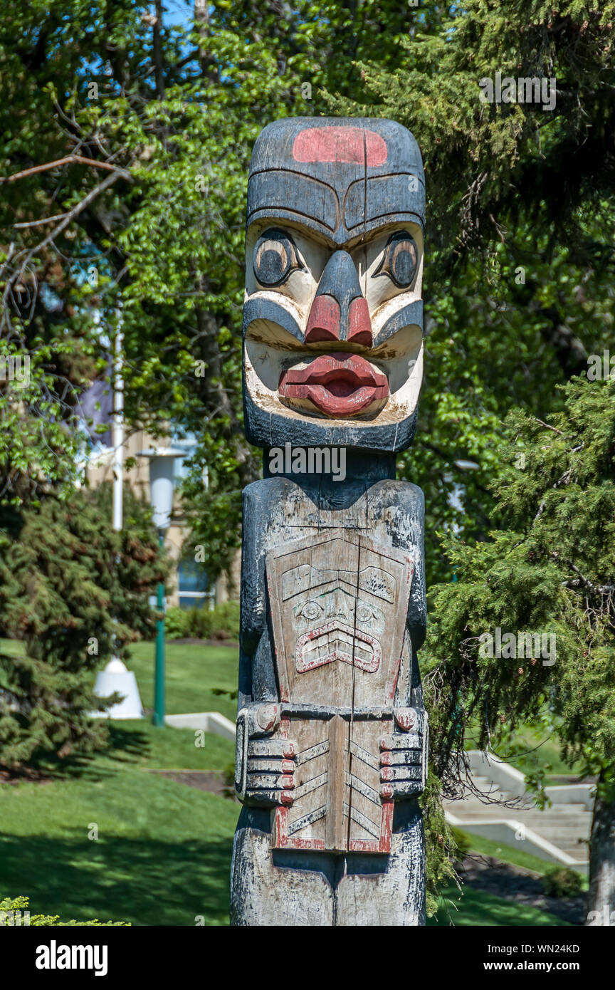 West coast totem pole donated to Alberta Government and sits on legislative grounds. Stock Photo