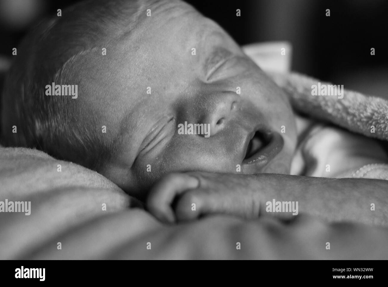 Closeup Of Newborn Baby Sleeping On Bed Stock Photo Alamy
